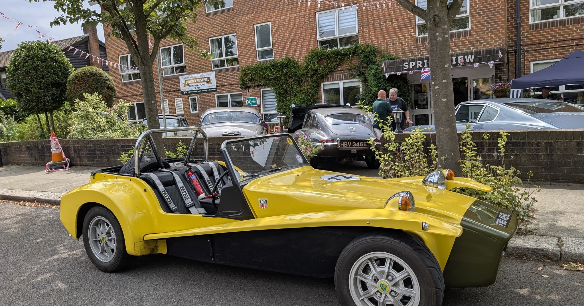 Classic yellow Lotus Seven sports car on show at Springview Care Home’s Summer Festival in Enfield