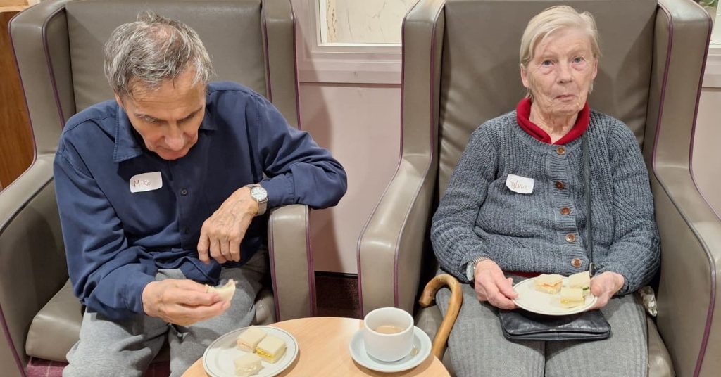 Residents sharing sandwiches together at Spring Lane Care Home, East Finchley.