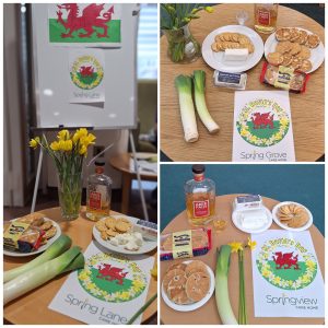 St David’s Day Welsh food display with Welsh cakes, goat’s cheese, daffodils and Welsh flag at Springdene Care Homes.