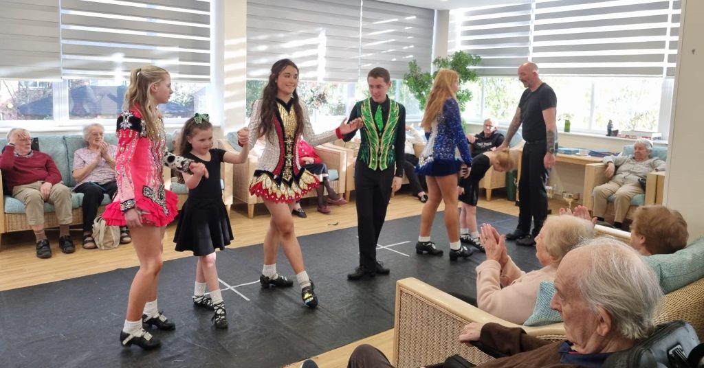 Residents enjoying a St Patrick's Day Irish dancing performance at Springdene Care Homes.