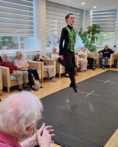 Irish dancer performing for residents during St Patrick's Day celebrations at Springdene.
