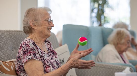 Photo-069 (Large) Resident enjoying a gentle ball game during an activity session at Springview Care Home in Enfield.