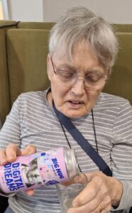 Resident exploring a new beer during the Beer Day Britain tasting at Springdene Care Homes