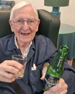 Resident enjoying a beer tasting for Beer Day Britain at Springdene Care Homes