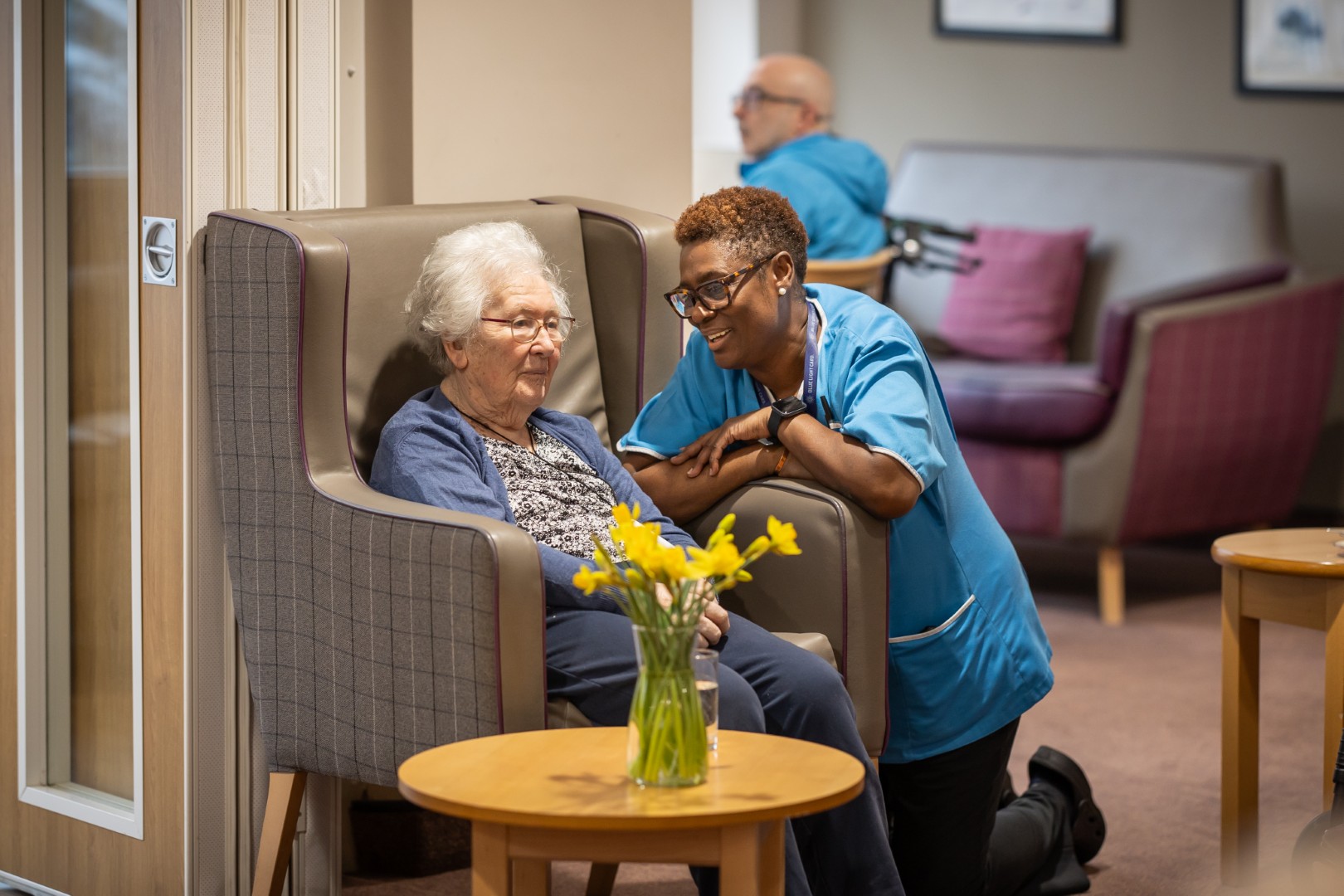 Springdene carer spending one-to-one time with a resident