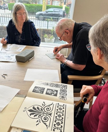 Residents taking part in lino printing with Springdene Care Homes' Artist in Residence.