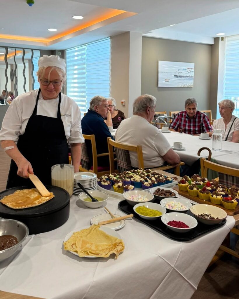 Chef preparing fresh crêpes for residents during World Chocolate Day at Springdene Care Homes.